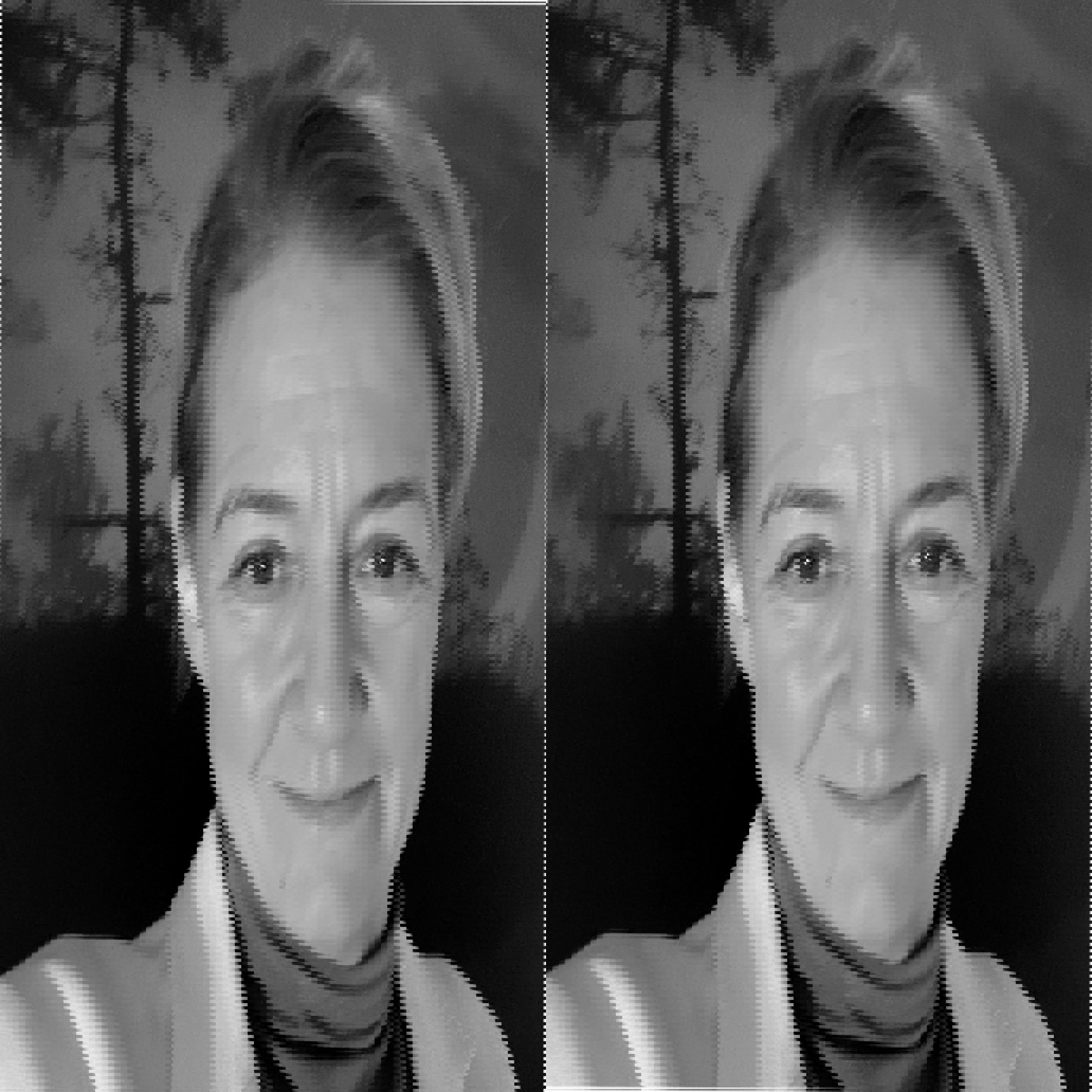 En kvinne smiler mot kameraet, iført jakke og høyhalset genser, med trær i bakgrunnen. Bildet er i svart-hvitt.